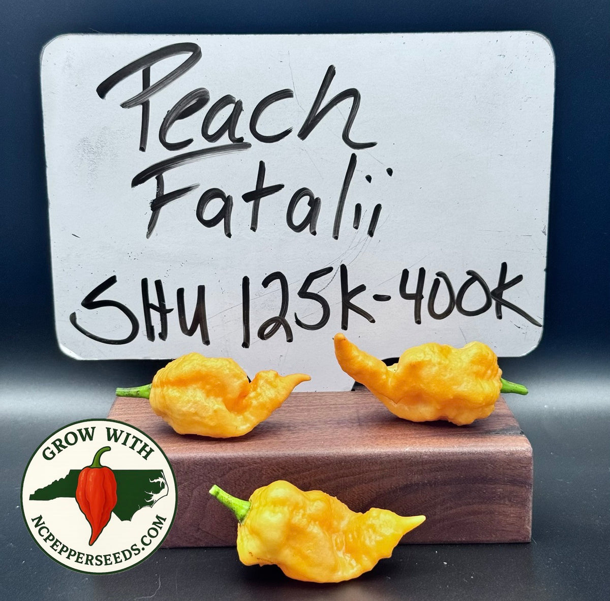 Peach Fatalii peppers — 125,000–400,000 SHU